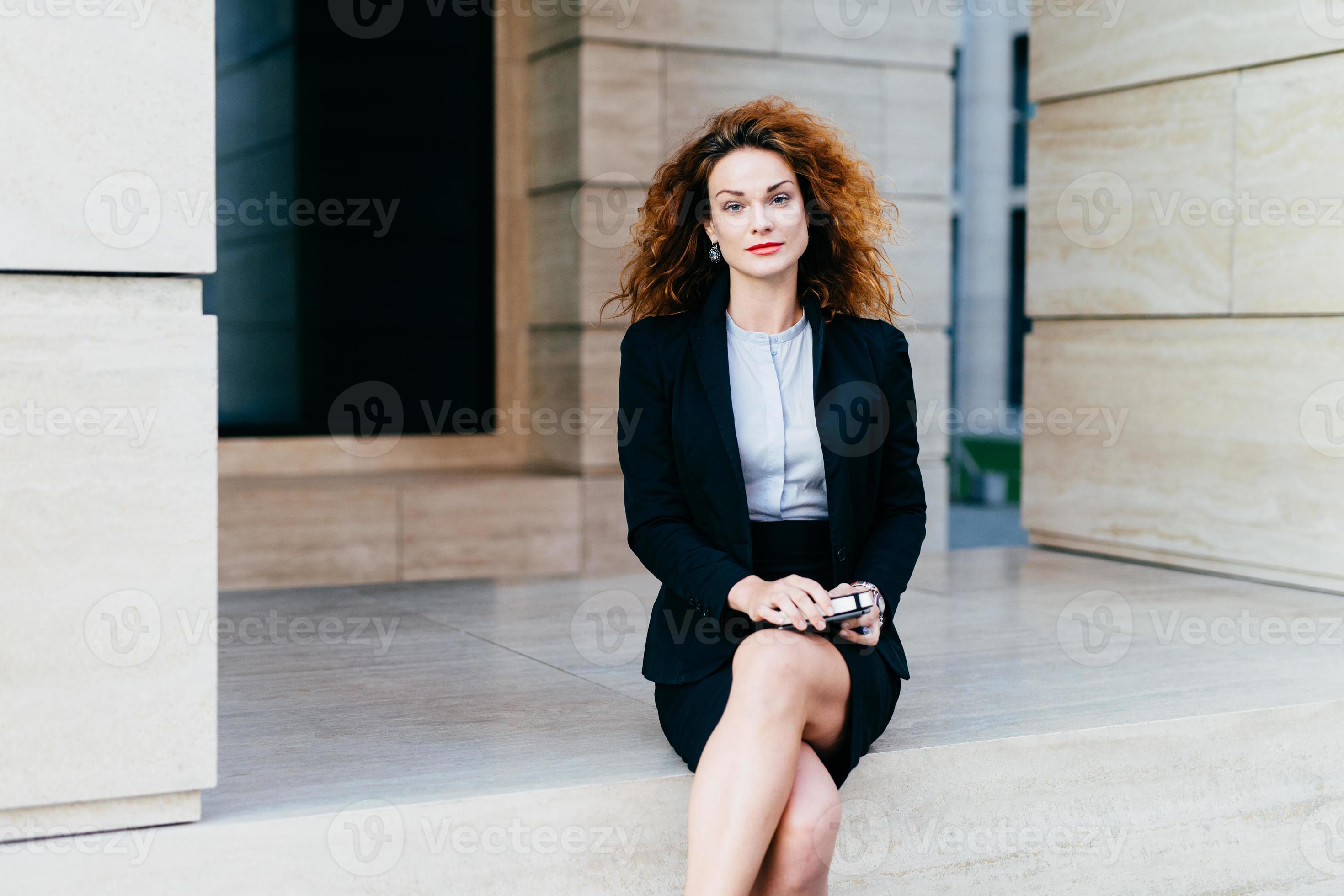 Attractive Young Woman Wearing Black Formal Suit Sitting Crossed Legs