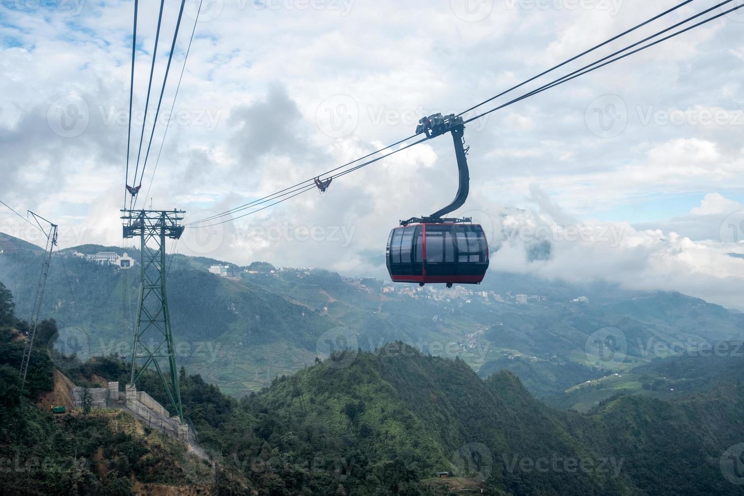 Red cable car sightseeing Sapa village in valley photo