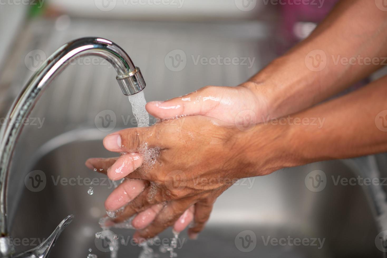 Men's hands are showing ways to wash their hands with a cleaning gel to prevent infectious diseases and prevent the virus. photo