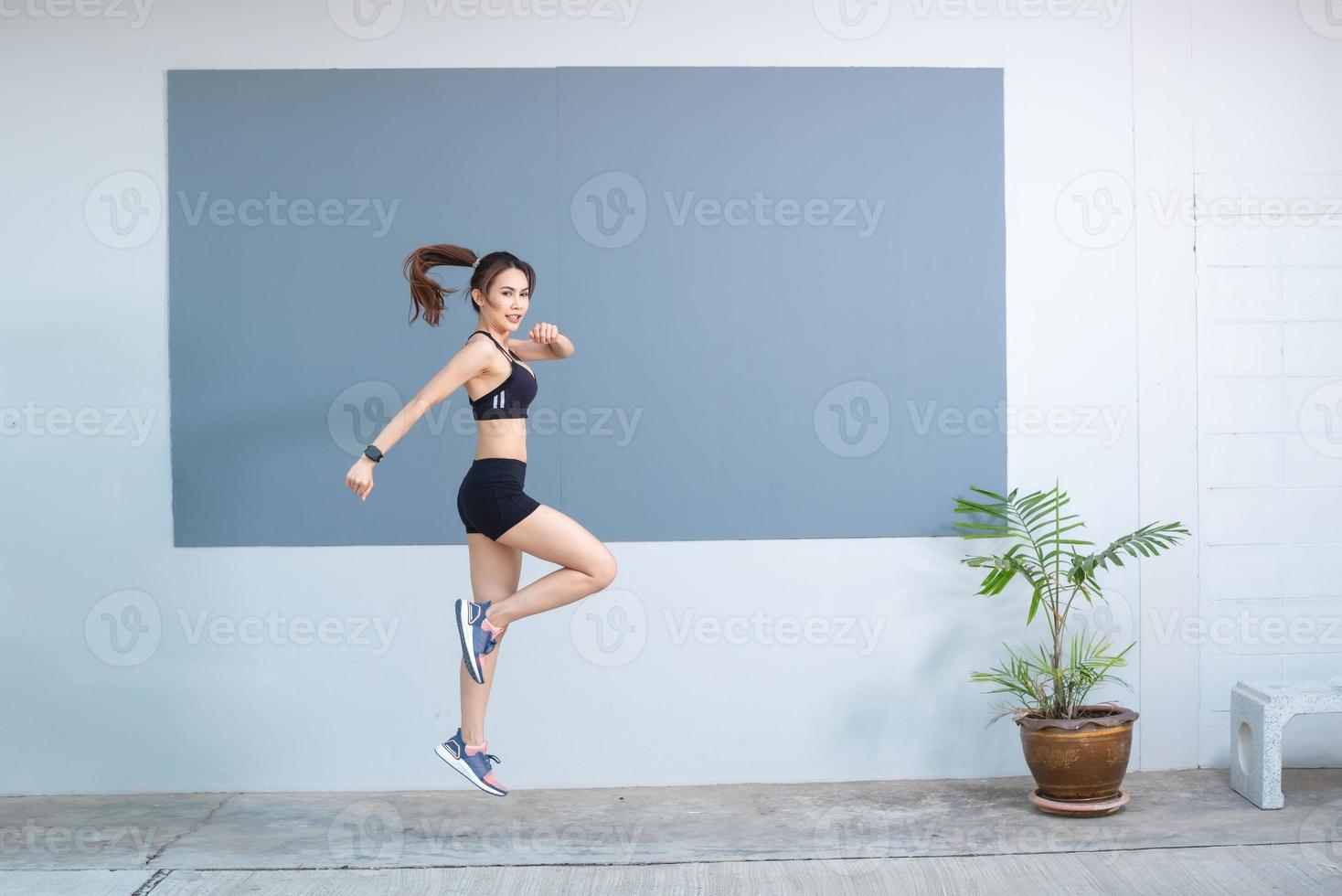 Beautiful asian woman She is exercising and jumping up. photo