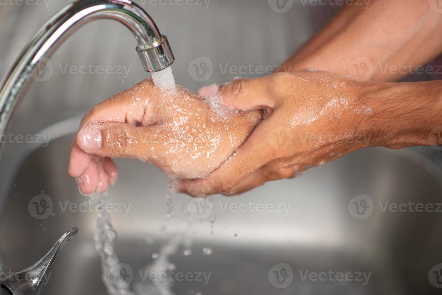 Men's hands are showing ways to wash their hands with a cleaning gel to prevent infectious diseases and prevent the virus. photo