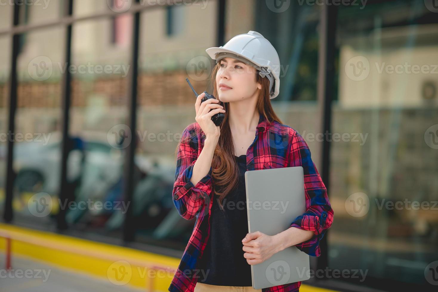 Angry Asian woman uses top-of-the-line radio. photo