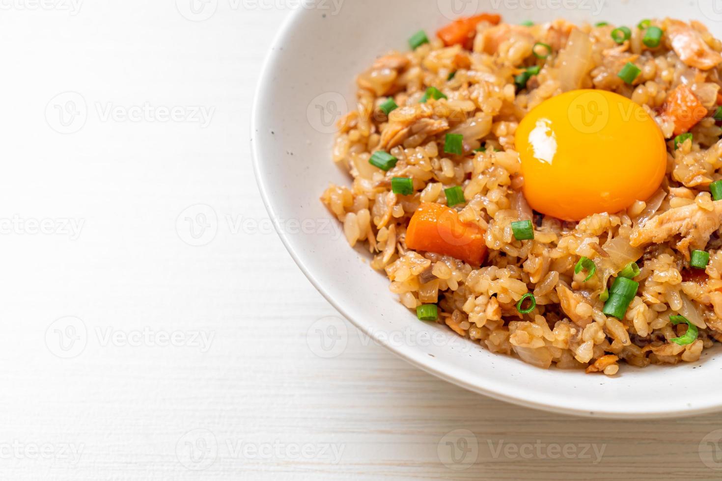 salmon fried rice with pickled egg on top photo