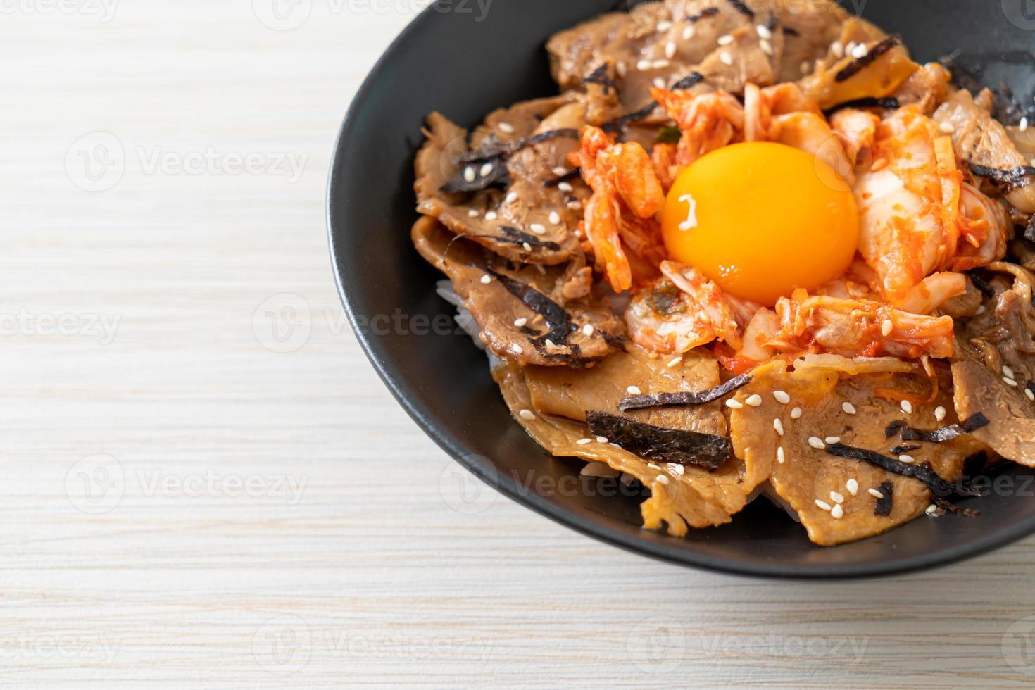 pork bulgogi rice bowl with kimchi and Korean pickled egg photo