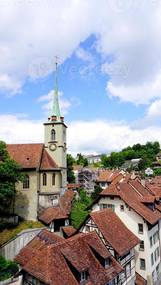 historical old town city and church on bridge in Bern, Switzerland, Europe photo