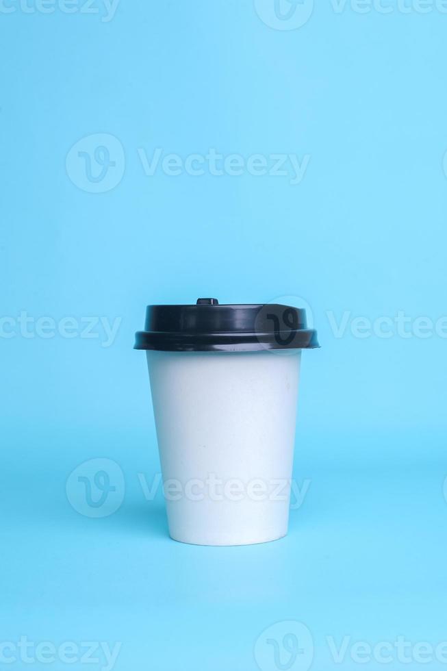 White paper cup isolated on blue background. Realistic set mock up for branding,  template for your design, presentation, promo, ad. photo