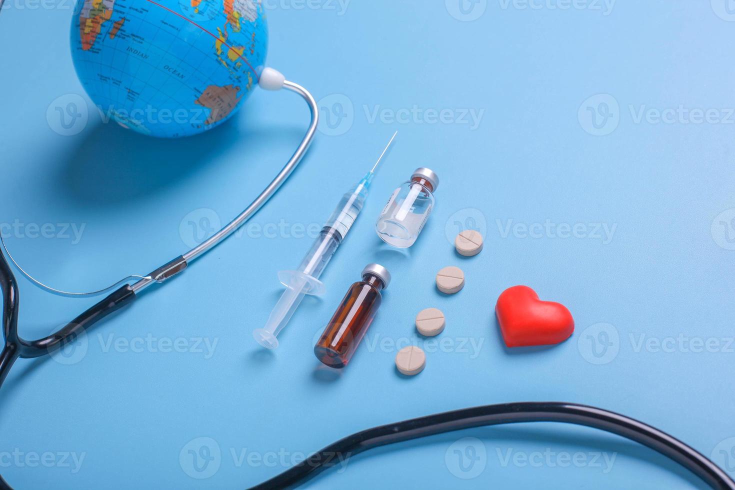 High angle view various medical devices for world health concept on blue background photo