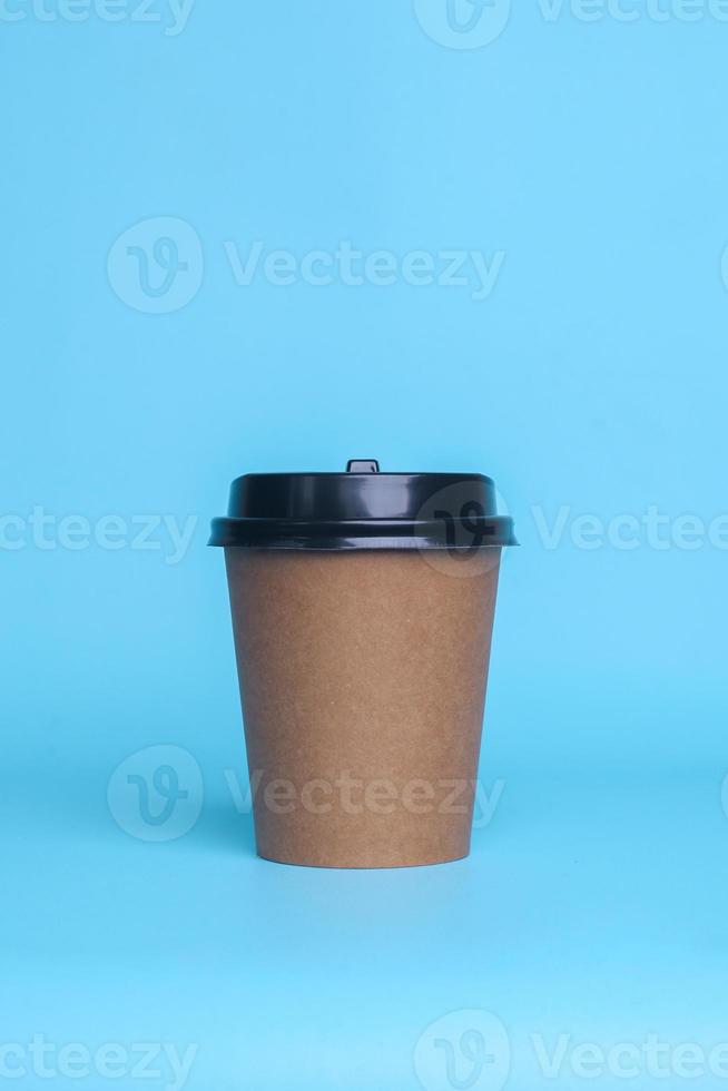 Disposable paper cup isolated on blue background. Realistic set mock up for branding,  template for your design, presentation, promo, ad photo