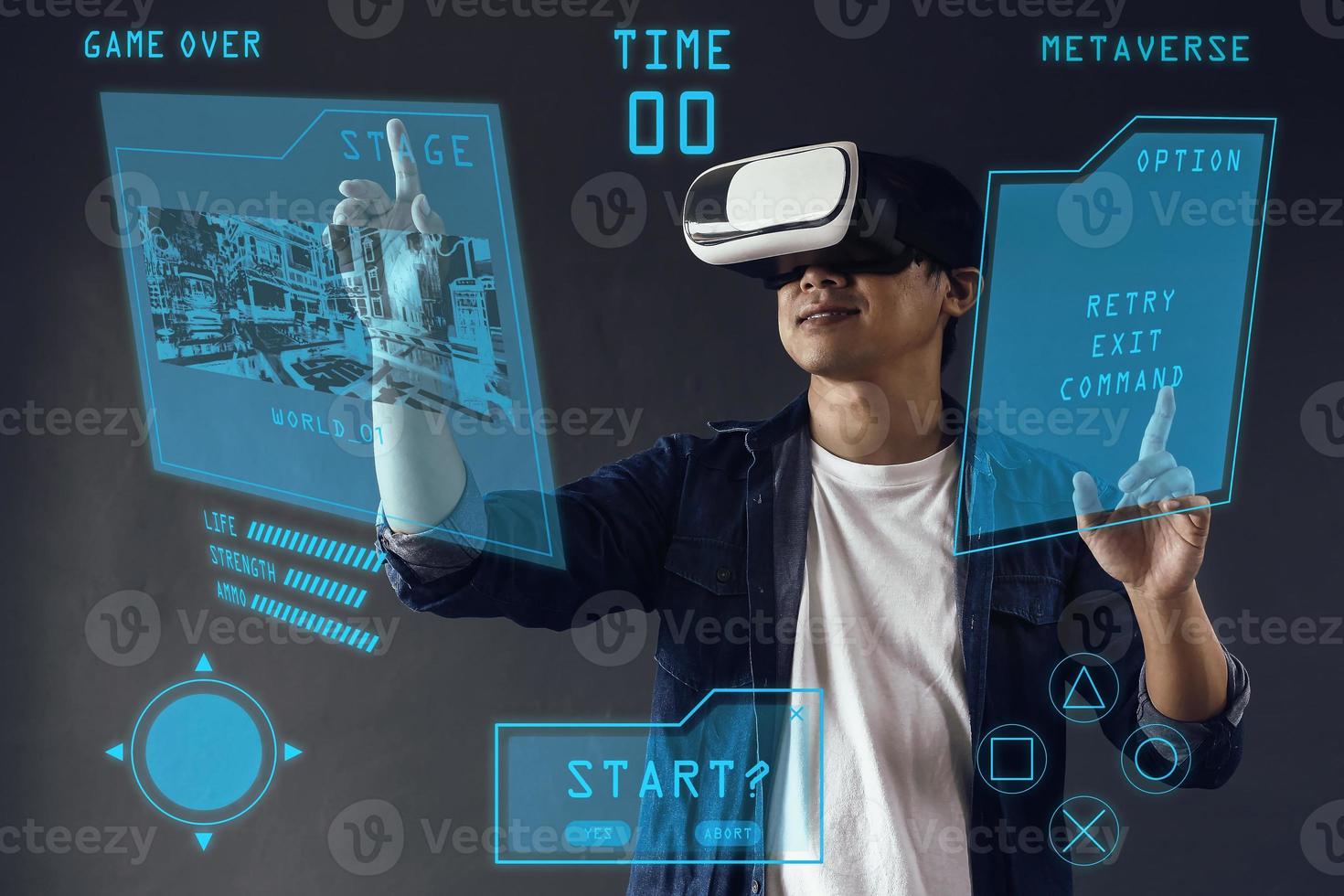 Smiling man touching 3d visual simulation using virtual reality goggle on dark grey background. Futuristic games concept. photo