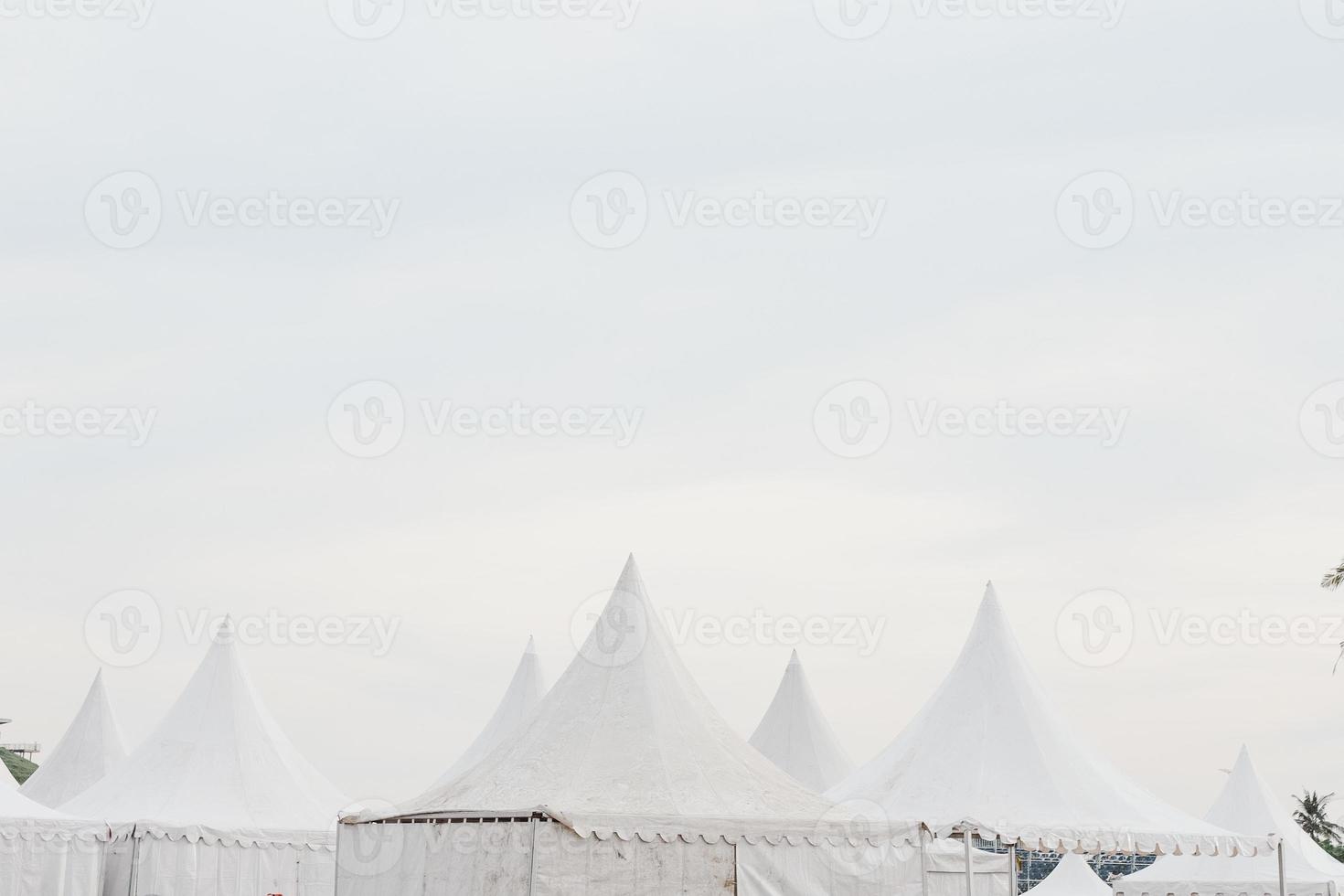 The top of giant white wedding, entertainment or carnival tents photo