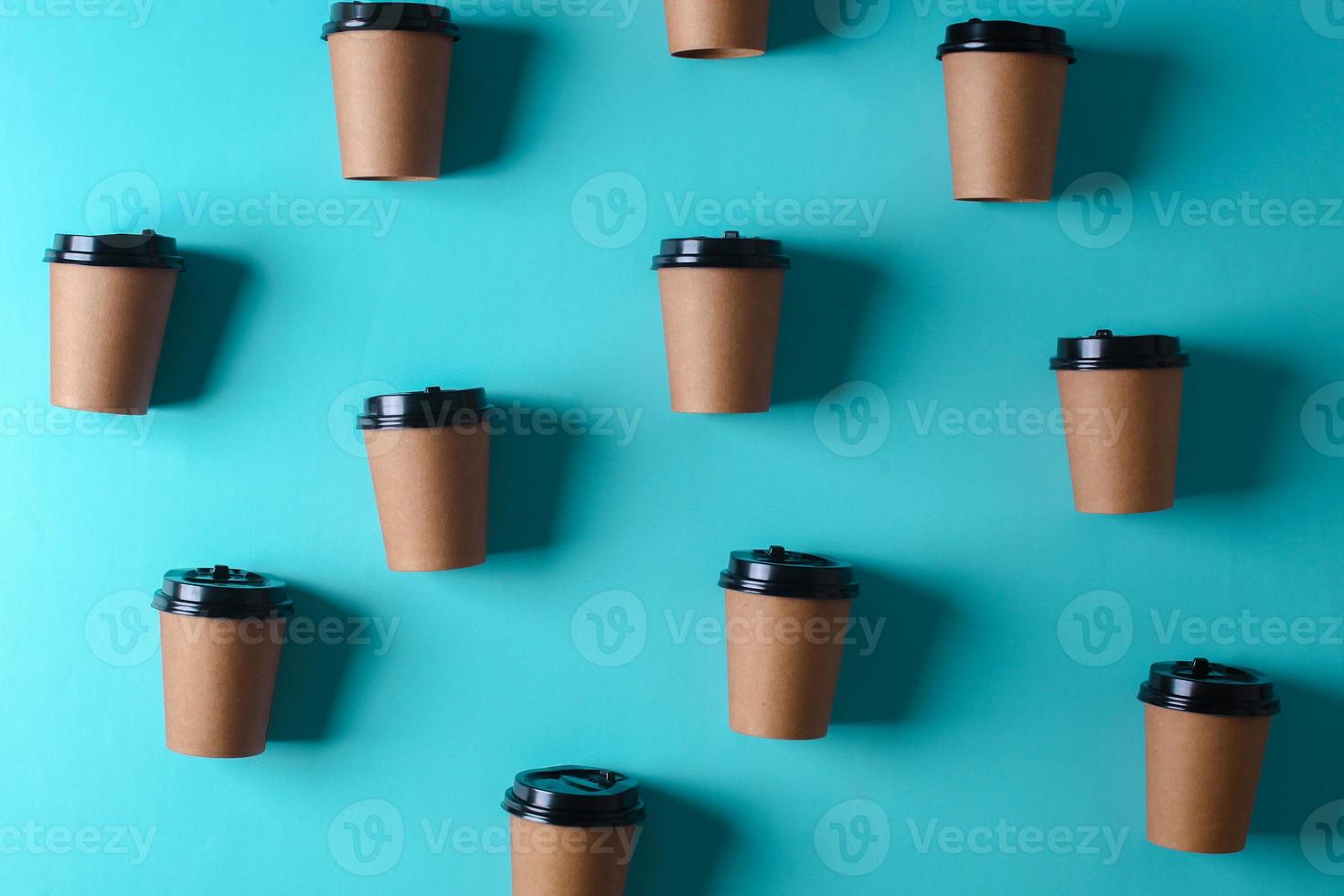 Take away paper cups on turquoise background. Realistic set mock up for branding,  template for your design, presentation, promo, ad. photo