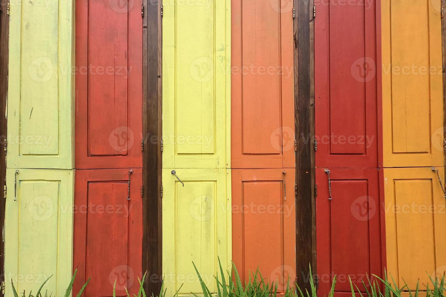 Collage of pastel color windows with green grass photo