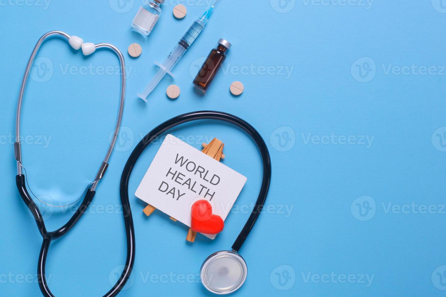 Creative flat lay composition of world health day on pastel blue background with copy space photo