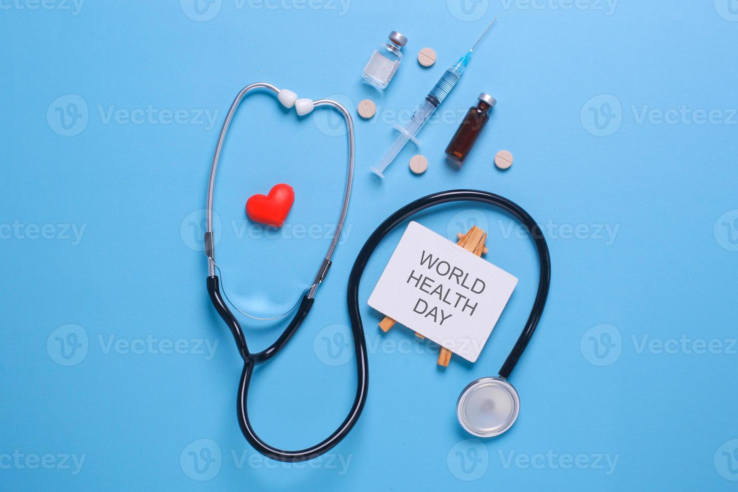 Creative flat lay composition of world health day on pastel blue background with copy space photo