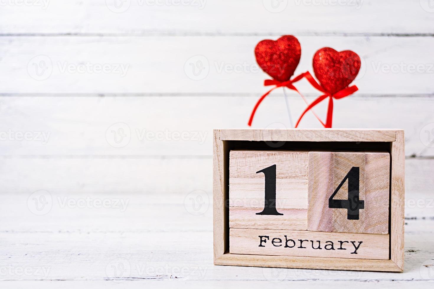 Valentine day. Wooden calendar with February 14 on it. photo