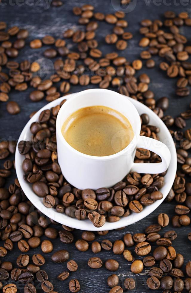 Cup of coffee espresso. Hot drink coffee on dark background photo