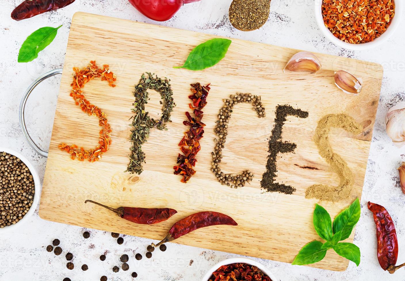 Different spices on white background. Top view photo
