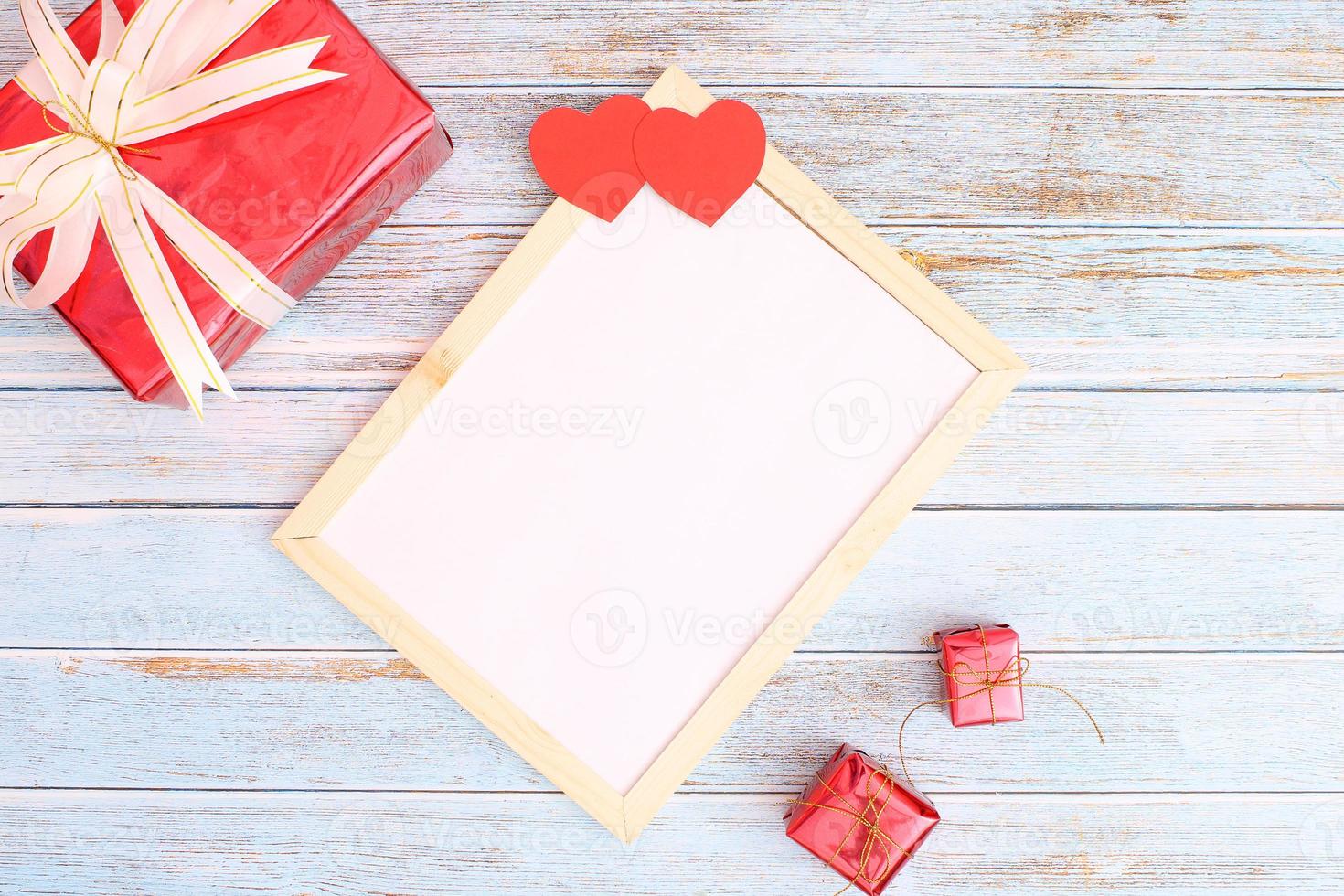 Heart with a gift box and a blank frame photo