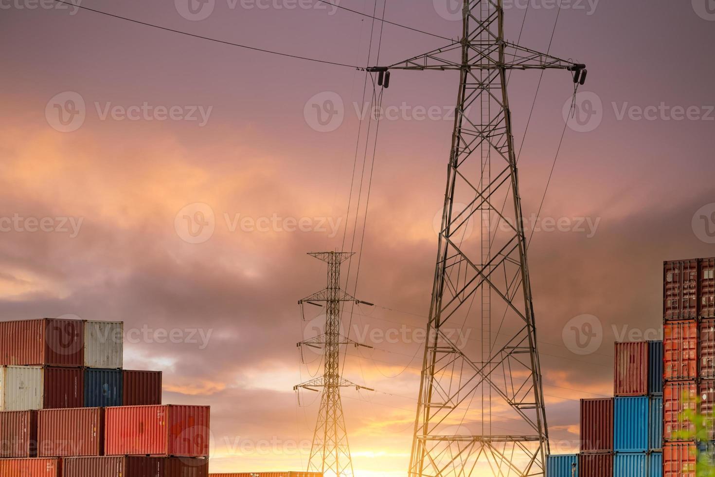 Logistic container stack with electric pylon. Cargo and shipping business. Container for truck transport. Container for import and export logistics. Logistic industry. Supply chain. Container freight. photo
