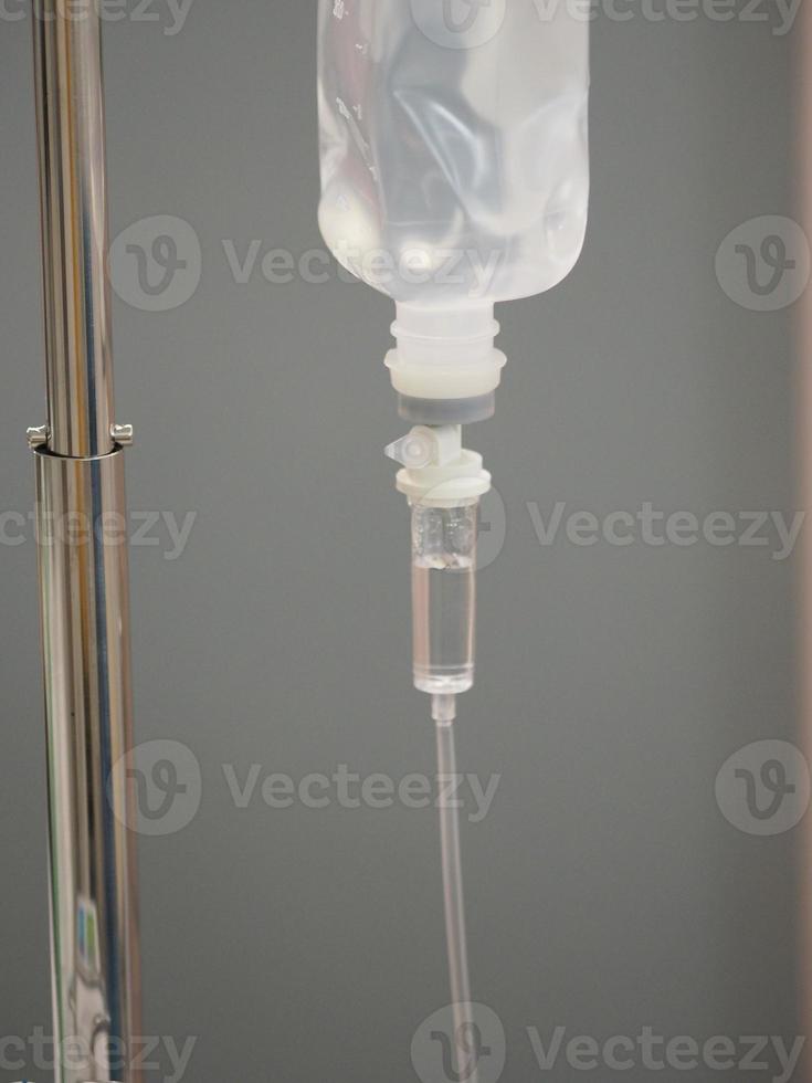 Set IV saline saline solution Fluid filled in pediatric patient hand in the hospital photo