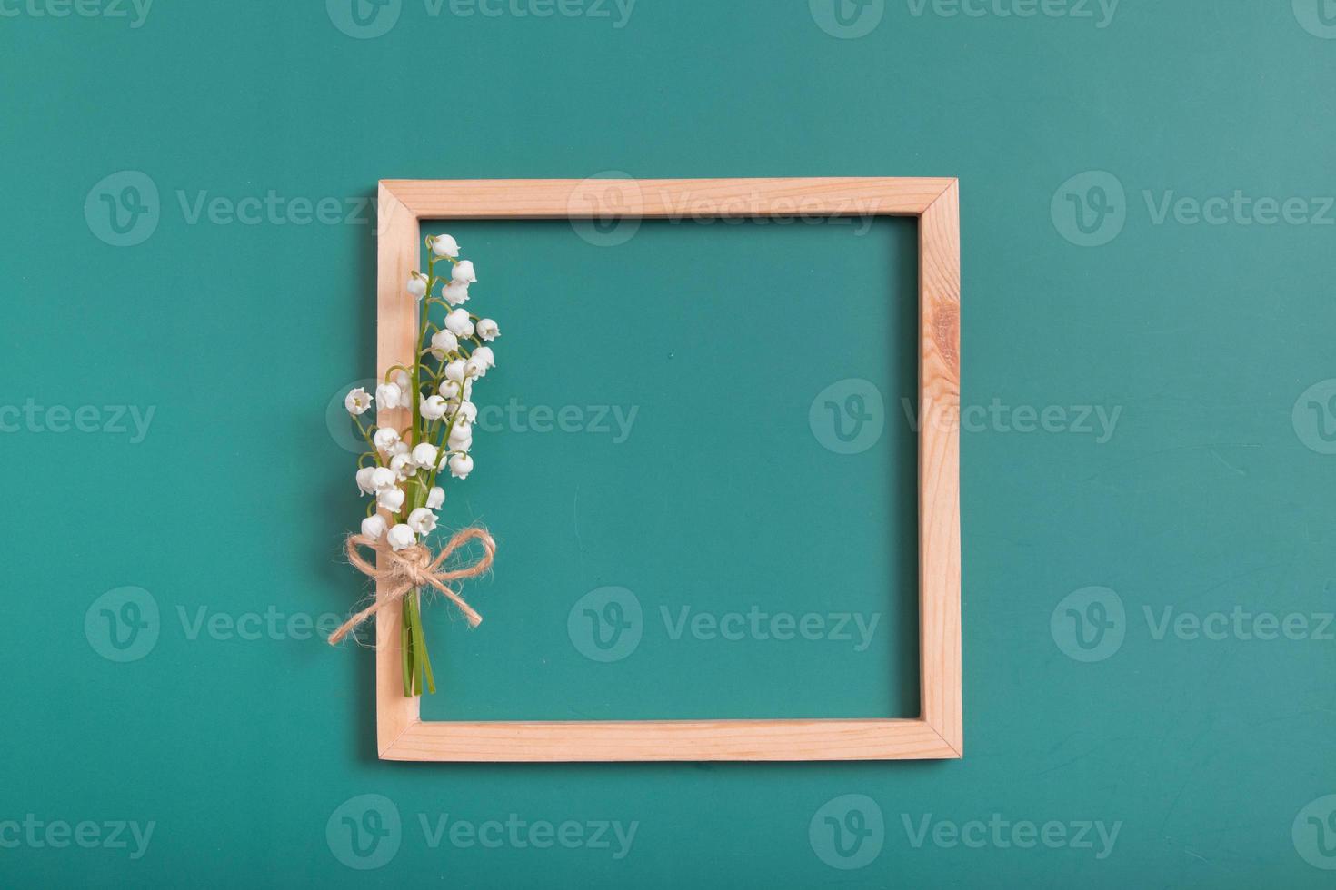 Summer or spring composition. Lily of the valley with square frame copy space top view. Summer, spring floral concept photo