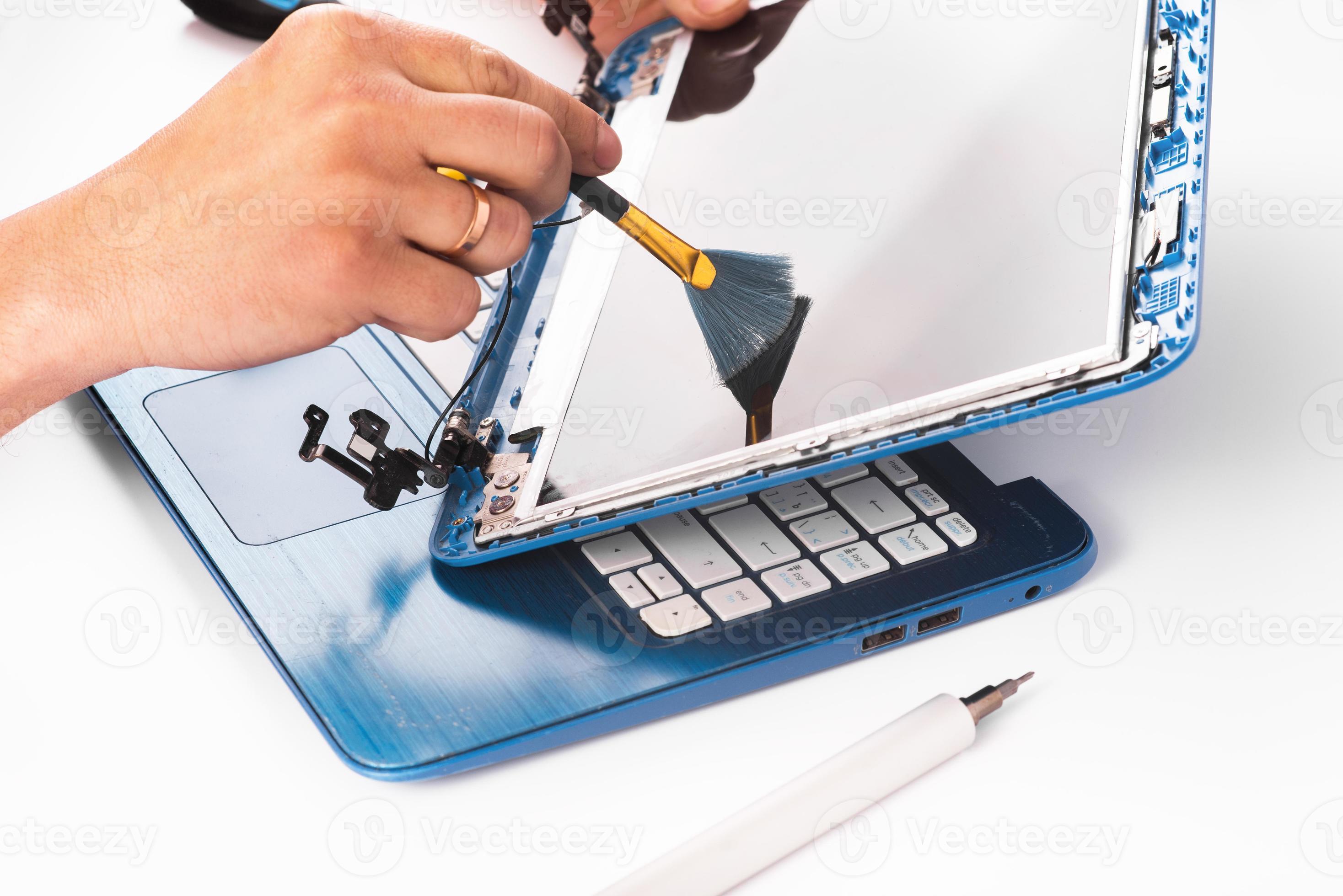 The engineer repairs blue laptop, pc, computer and the screen. laptop