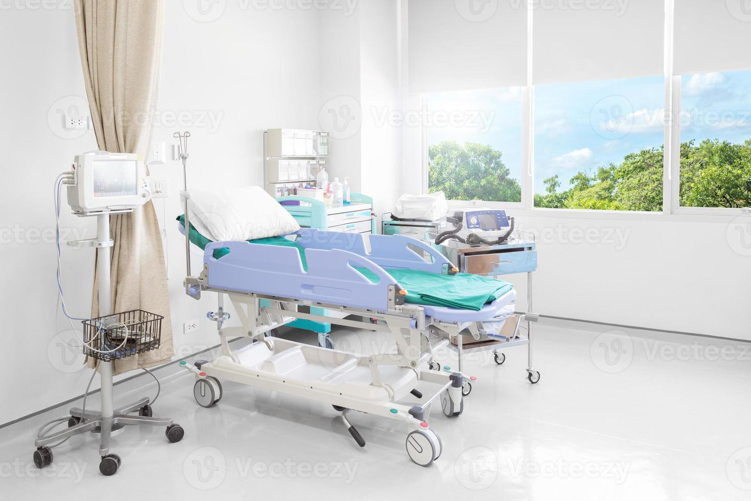 Hospital room with beds and comfortable medical equipped in a modern hospital photo