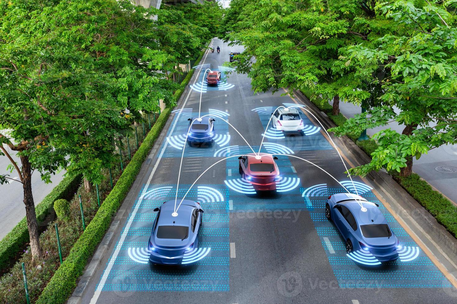 Smart cars with automatic sensor driving on green road with wireless connection photo