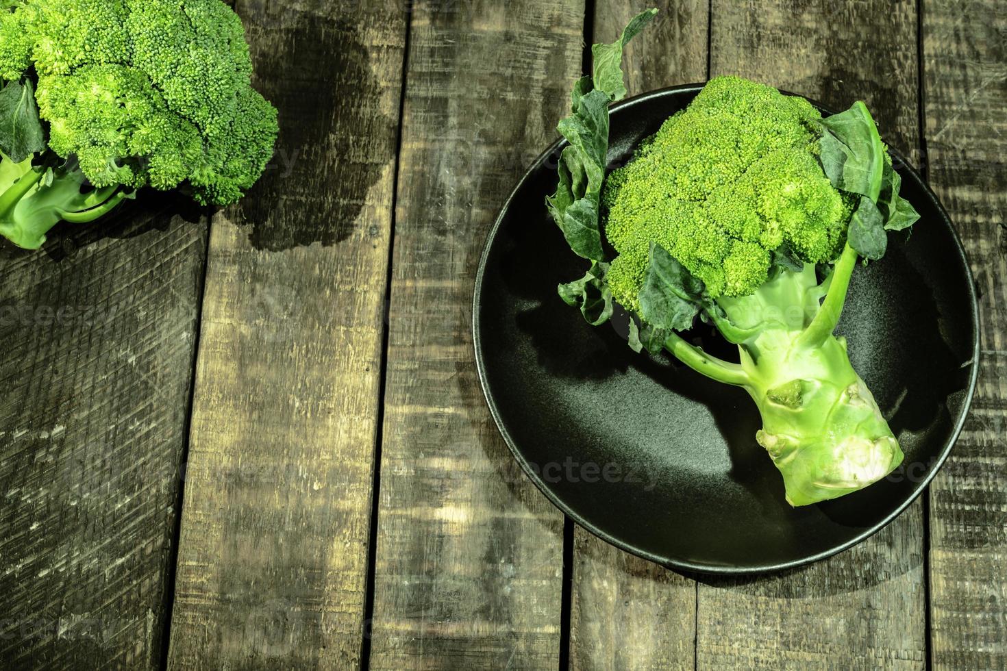Broccoli vegetable on wood healthy eating clean food concept. photo