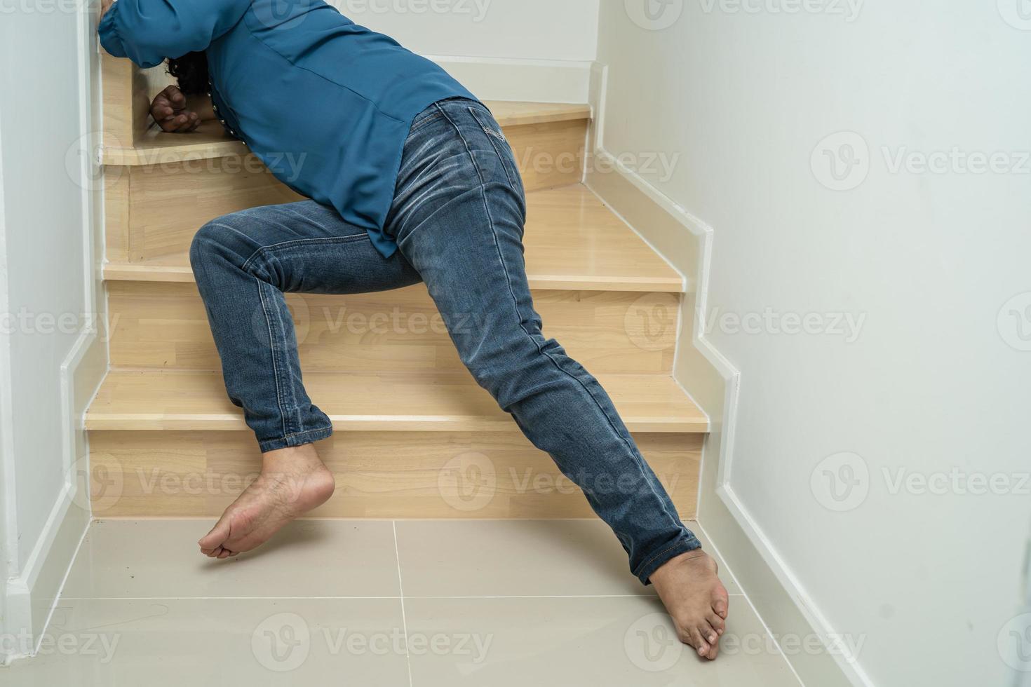 Asian lady woman patient fall down the stairs because slippery surfaces photo