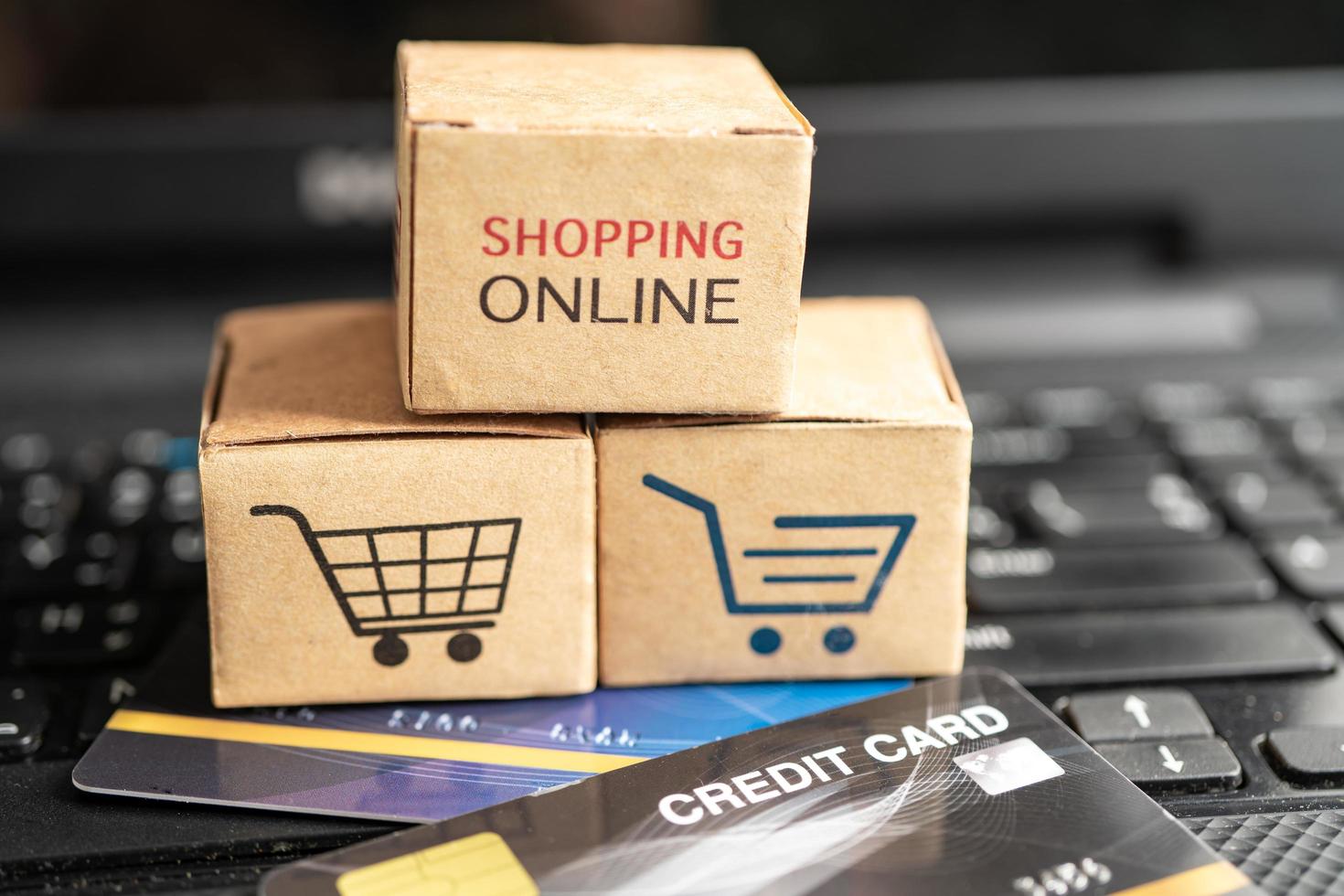 Shopping online box with credit card on laptop computer. Finance commerce import export business concept. photo
