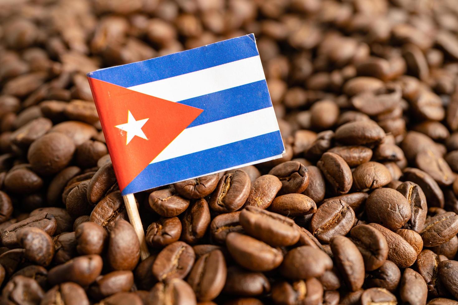 Cuba flag on coffee bean, import export trade online commerce concept. photo