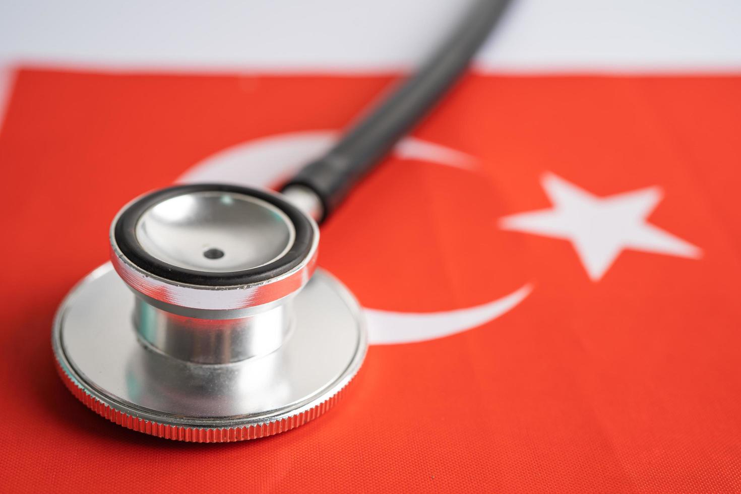 Black stethoscope on Turkey flag background, Business and finance concept. photo