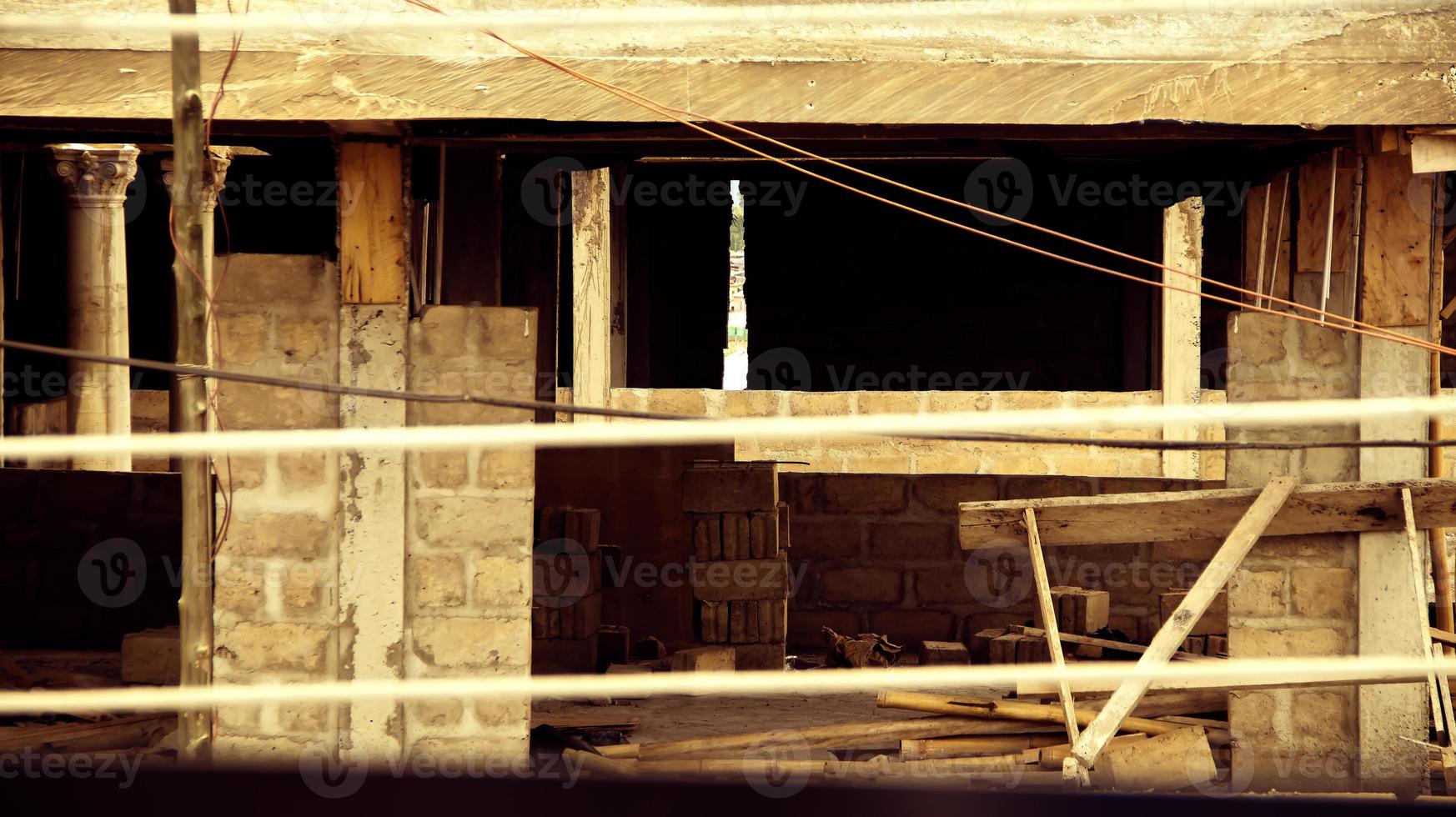 Abandoned uncompleted building. Scaffolding on building of construction site. photo