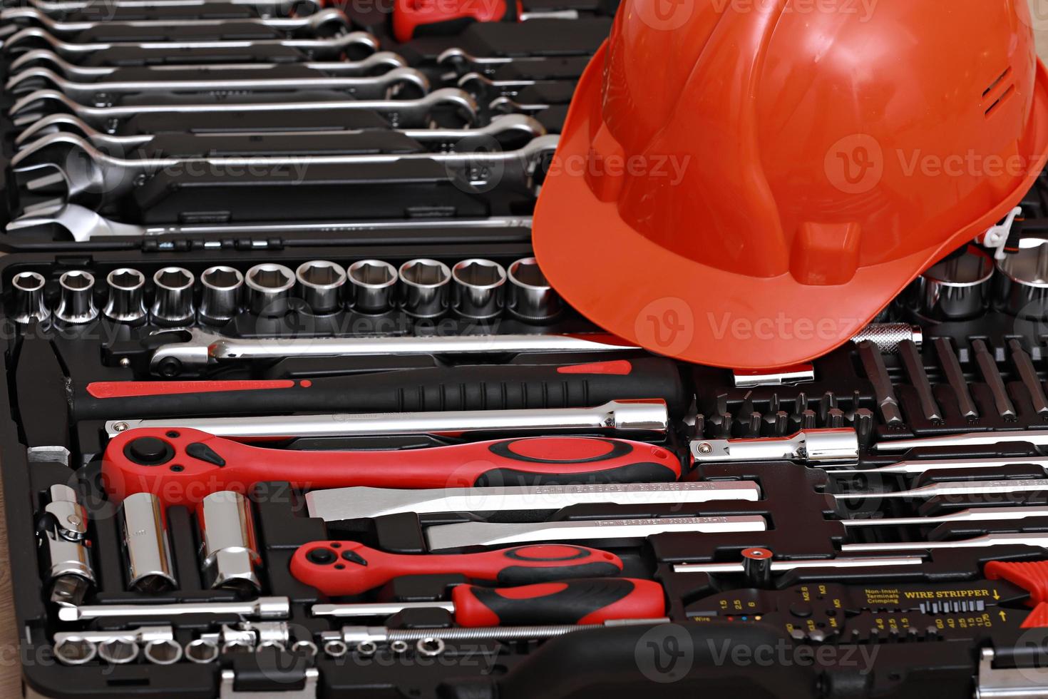 Toolbox, tools kit detail and orange protective helmet close up. instruments. set of tools. car tool kit. tool set background. instruments for repair. photo