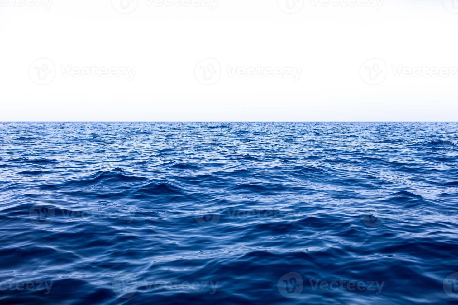 Calm Sea Ocean And Blue Sky Background photo