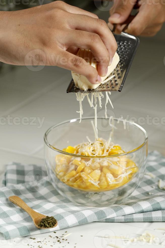 Grated Cheese Process Above Butter Corn, Step by Step Making Food Snack in the Kitchen photo