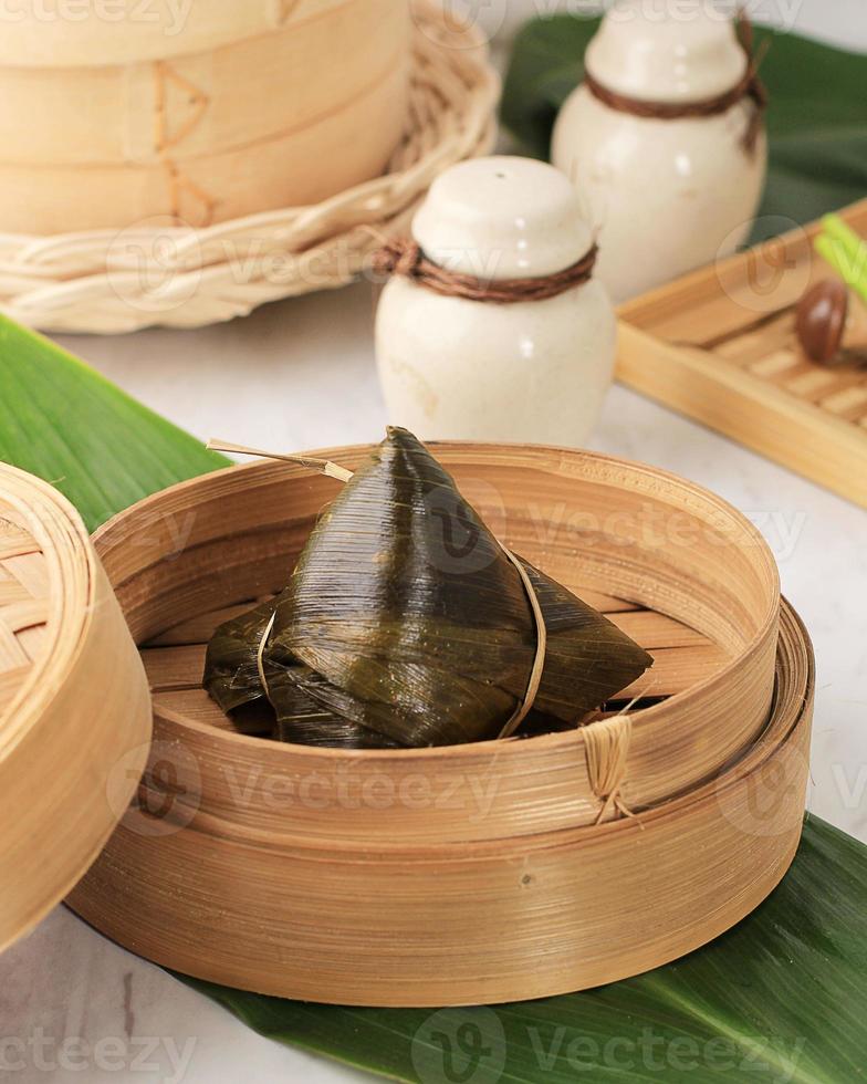 Rice Chinese Dumplings, Zongzi Bacang Usually Taken during Duanwu Festival Occasion. Rice Wrapped with Bamboo Leaves photo