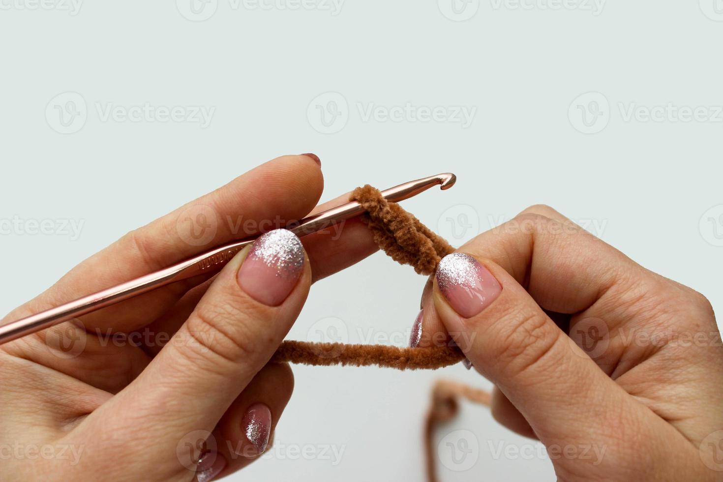 Crochet process of plush yarn. Start knitting a chain of loops photo