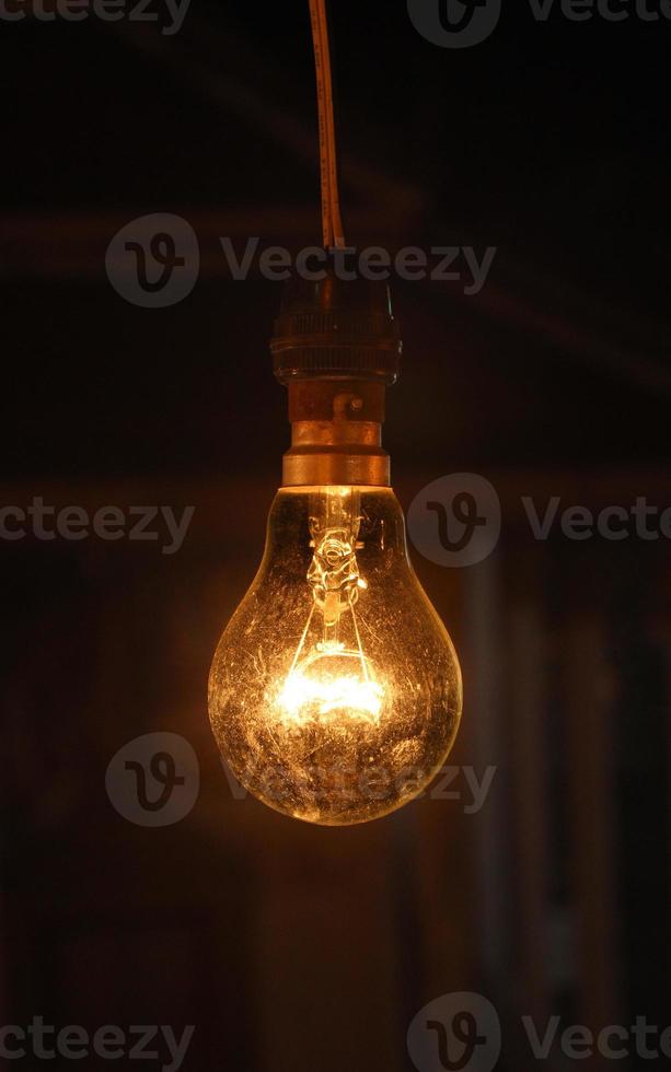 Old light bulbs shine in the darkness - images photo