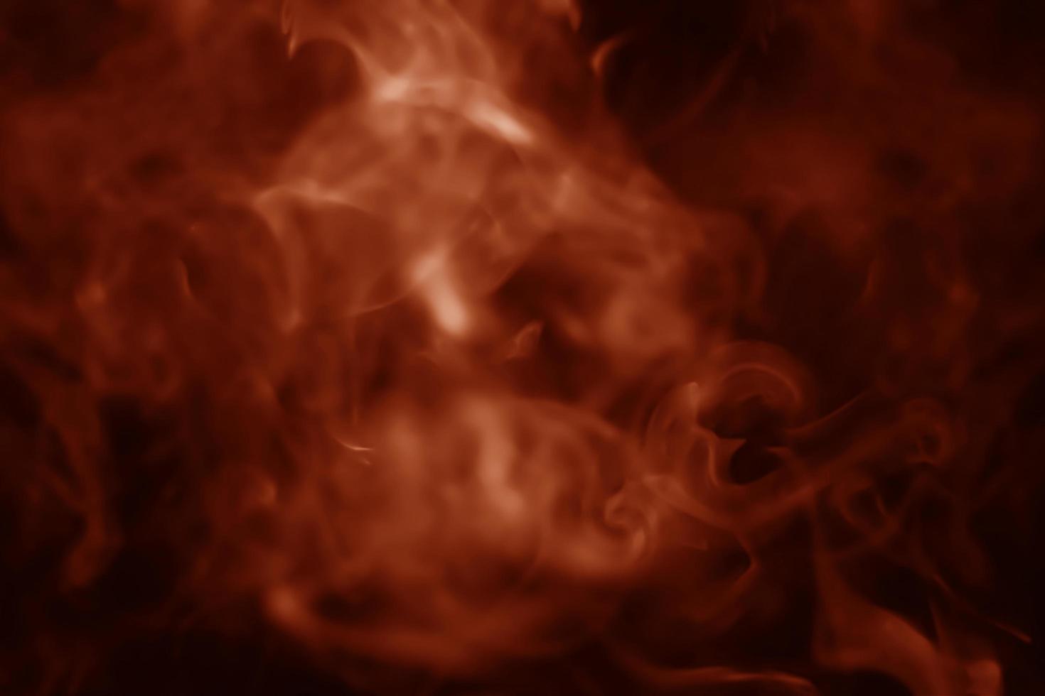 Abstract smoke, lush lava, a mixture of bright orange and dark red photo