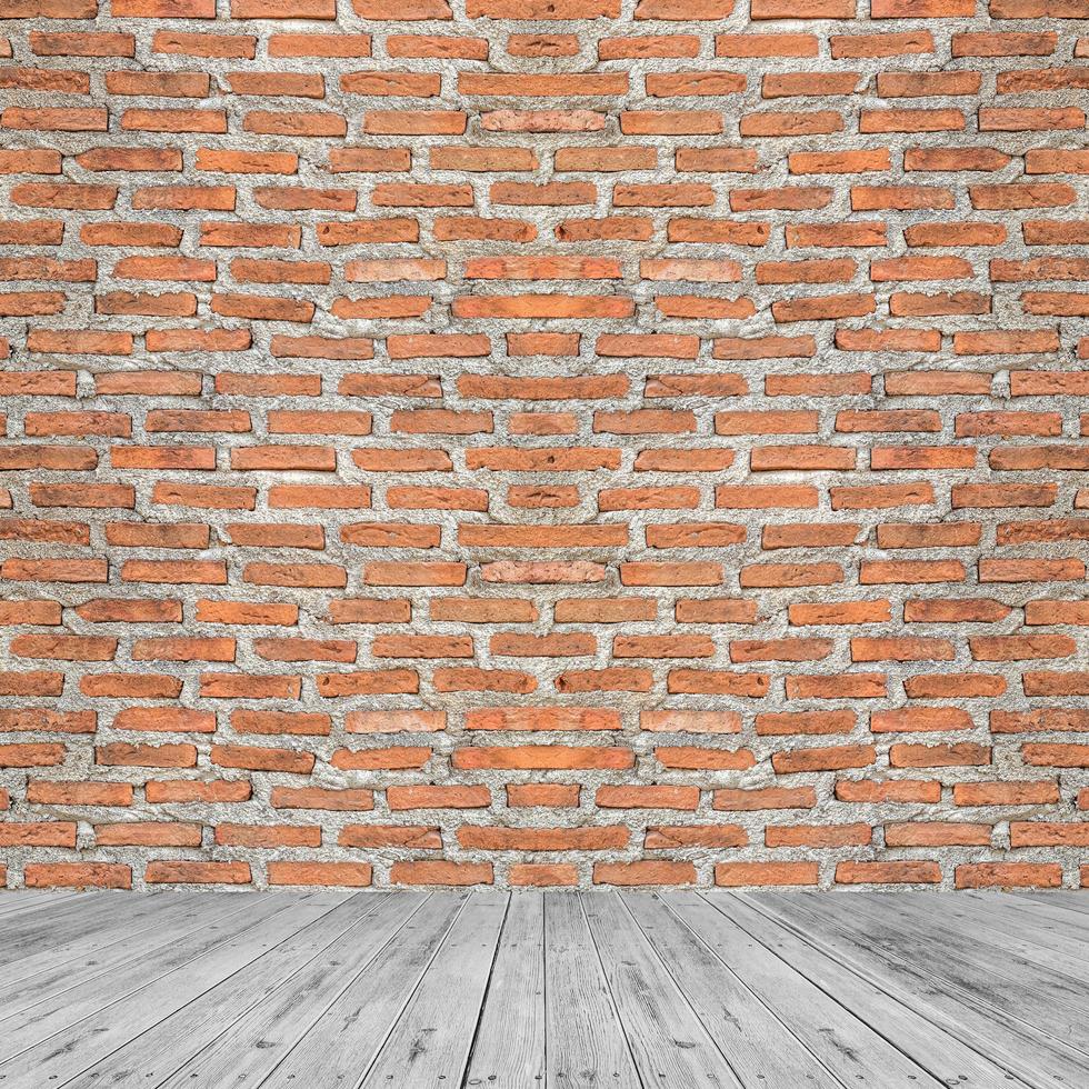 Red brick walls and wooden floors are combined into empty rooms and backgrounds. photo