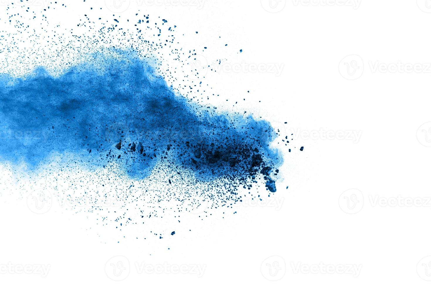 Bizarre forms of  blue powder explode cloud on background. Launched blue dust particles splash on white background. photo