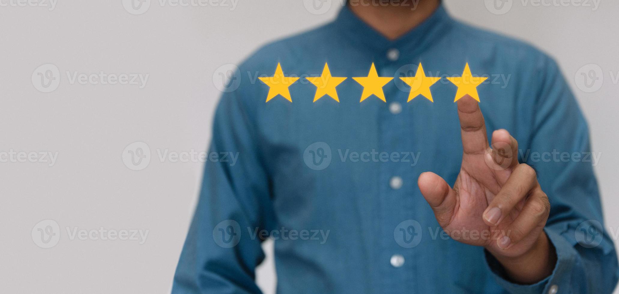 Businessmen wearing a light blue shirt to selecting the level of satisfaction score icons with copy space. Customer service experience and business satisfaction survey concept photo