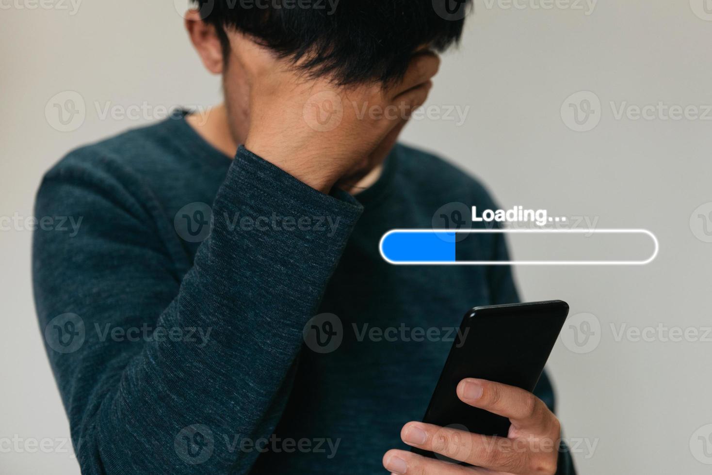 Man using phone and icon loading hologram effect. photo