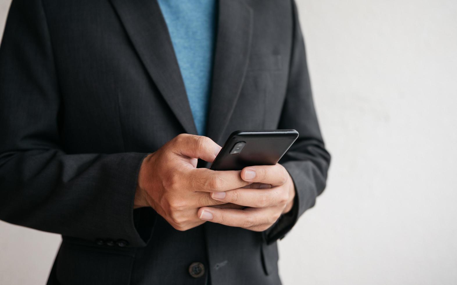 Man using cellphone for searching data and social media on internet. photo