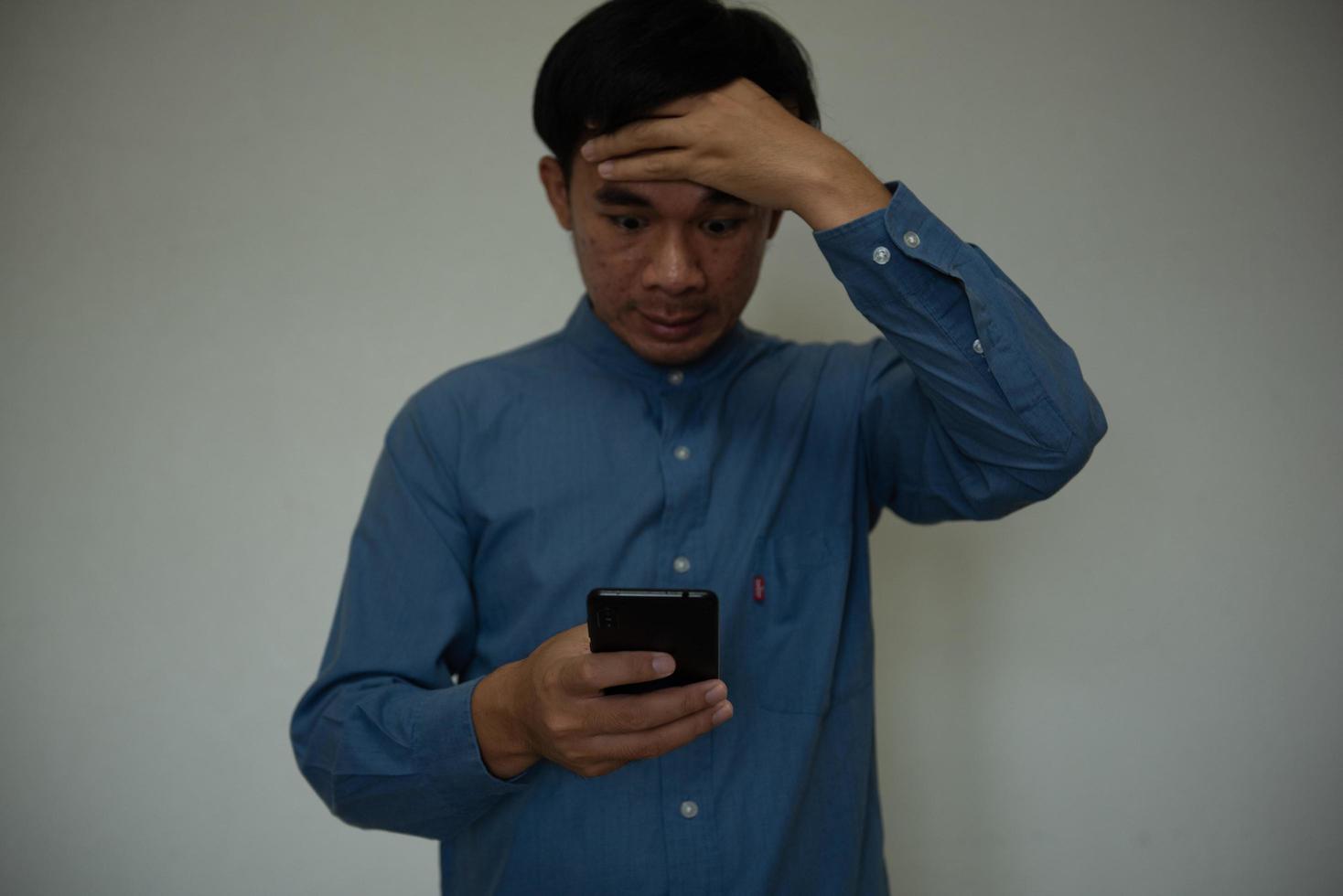 Young handsome man wearing light blue shirt with different behaviors at work photo