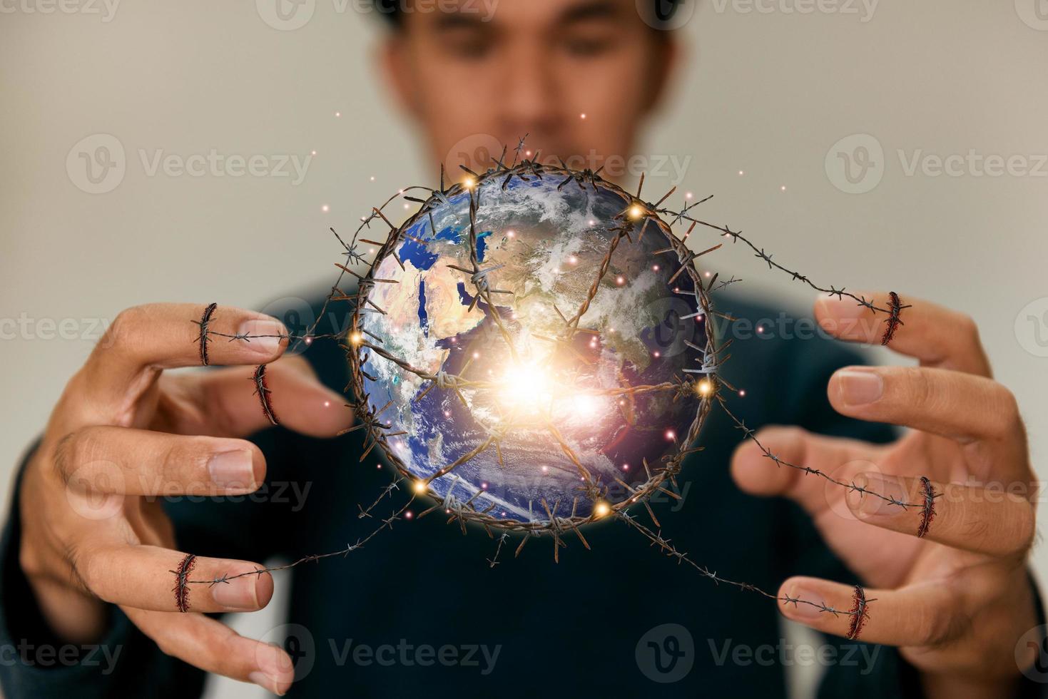 Man holding planet earth as destruction of the world, ecological and renewable energy world concept. Elements of this image furnished by NASA photo