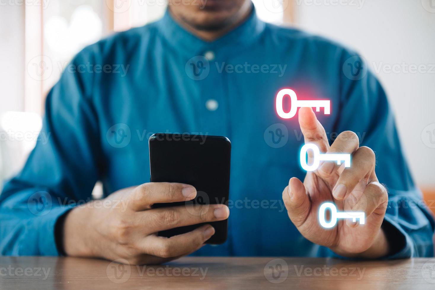 Mobile security concept, Man using a digital generated phone with security key photo