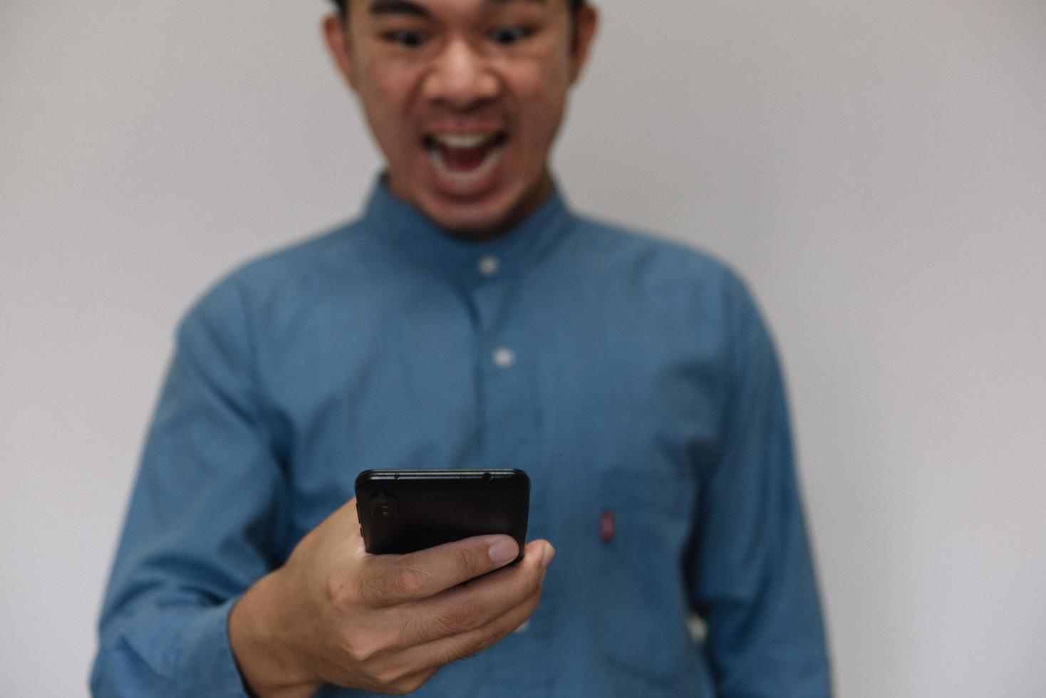 Young handsome man wearing light blue shirt with different behaviors at work photo